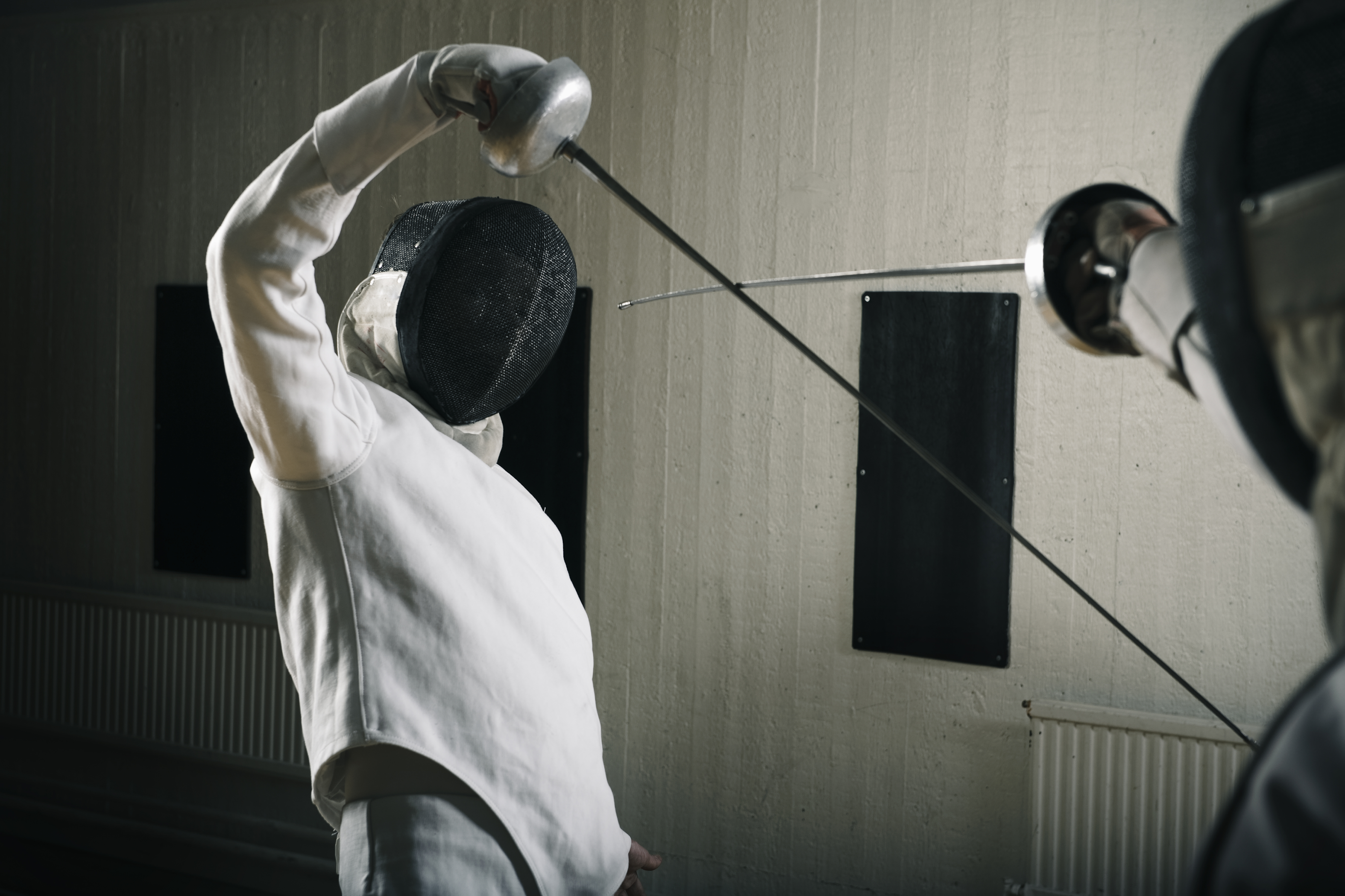 Fencer in defensive stance